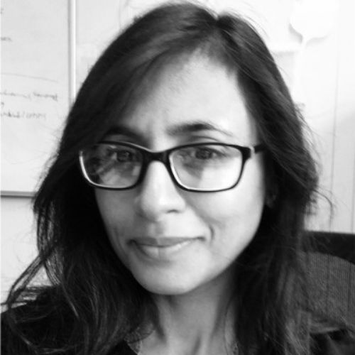Black and white photo of Hemini Mehta, dark hair, glasses.